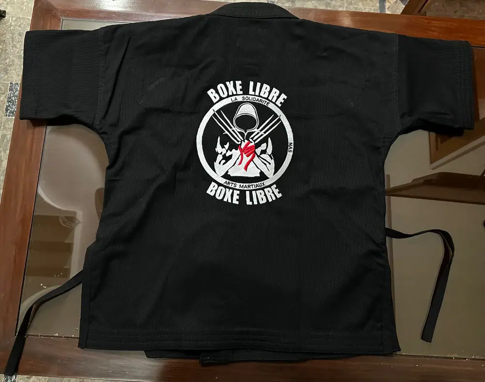 Chaqueta de combate de Boxe Libre de La Solidarité Arts Martiaux, logotipo en la espalda